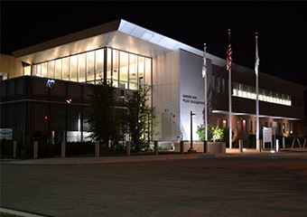 Hanover Park Police Headquarters at night with lights on